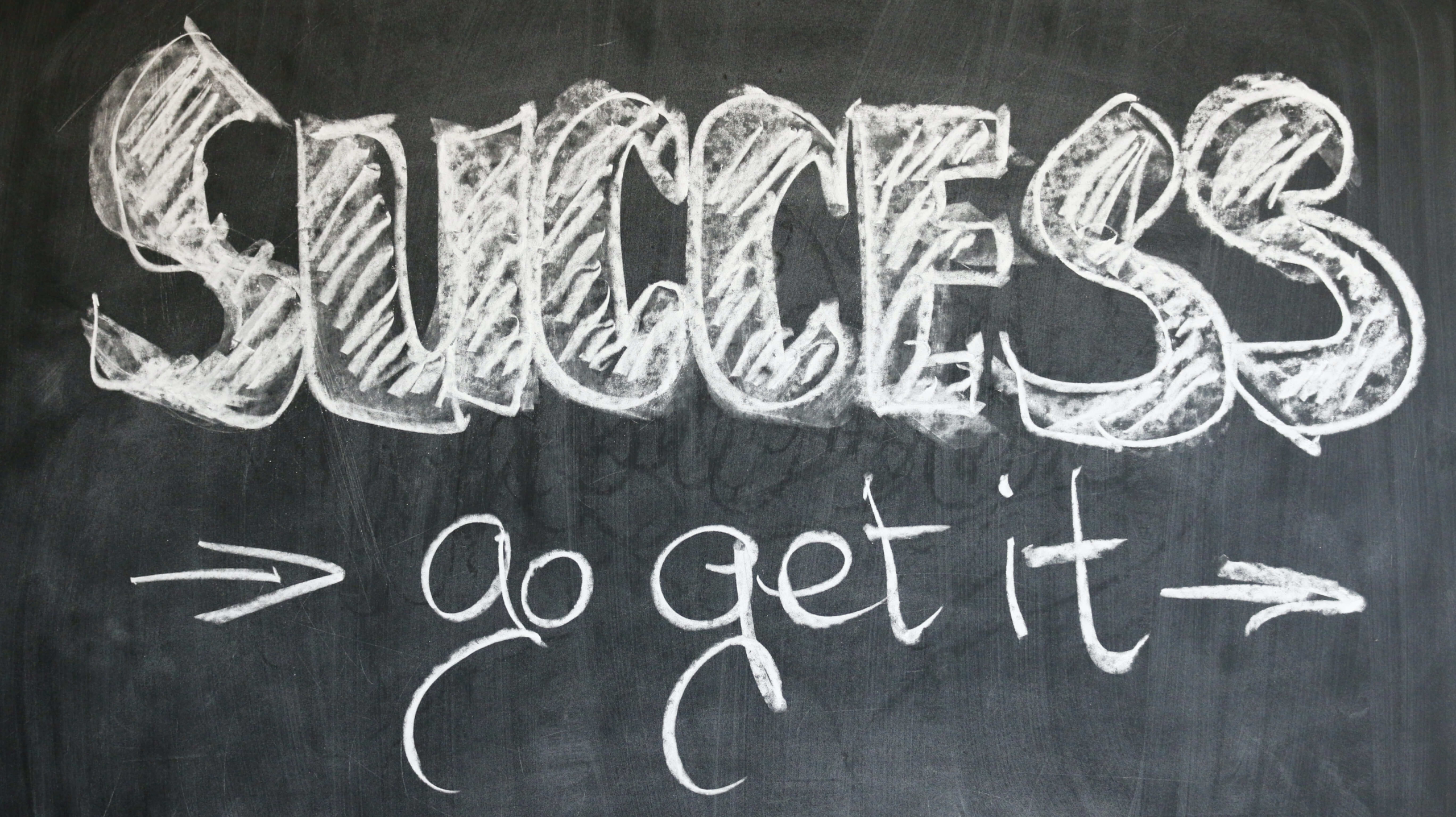 Blackboard has the words "Success: go get it" written on it